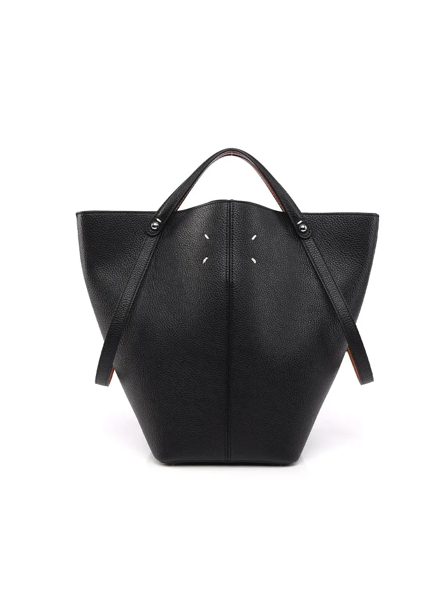 Black leather handbag with a unique geometric design on a white background