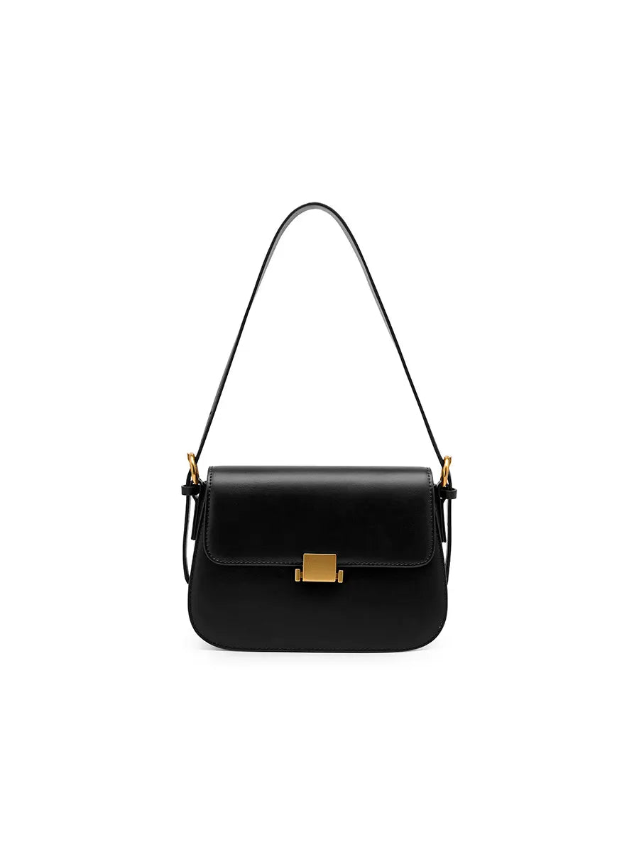 Black handbag with a gold clasp on a white background