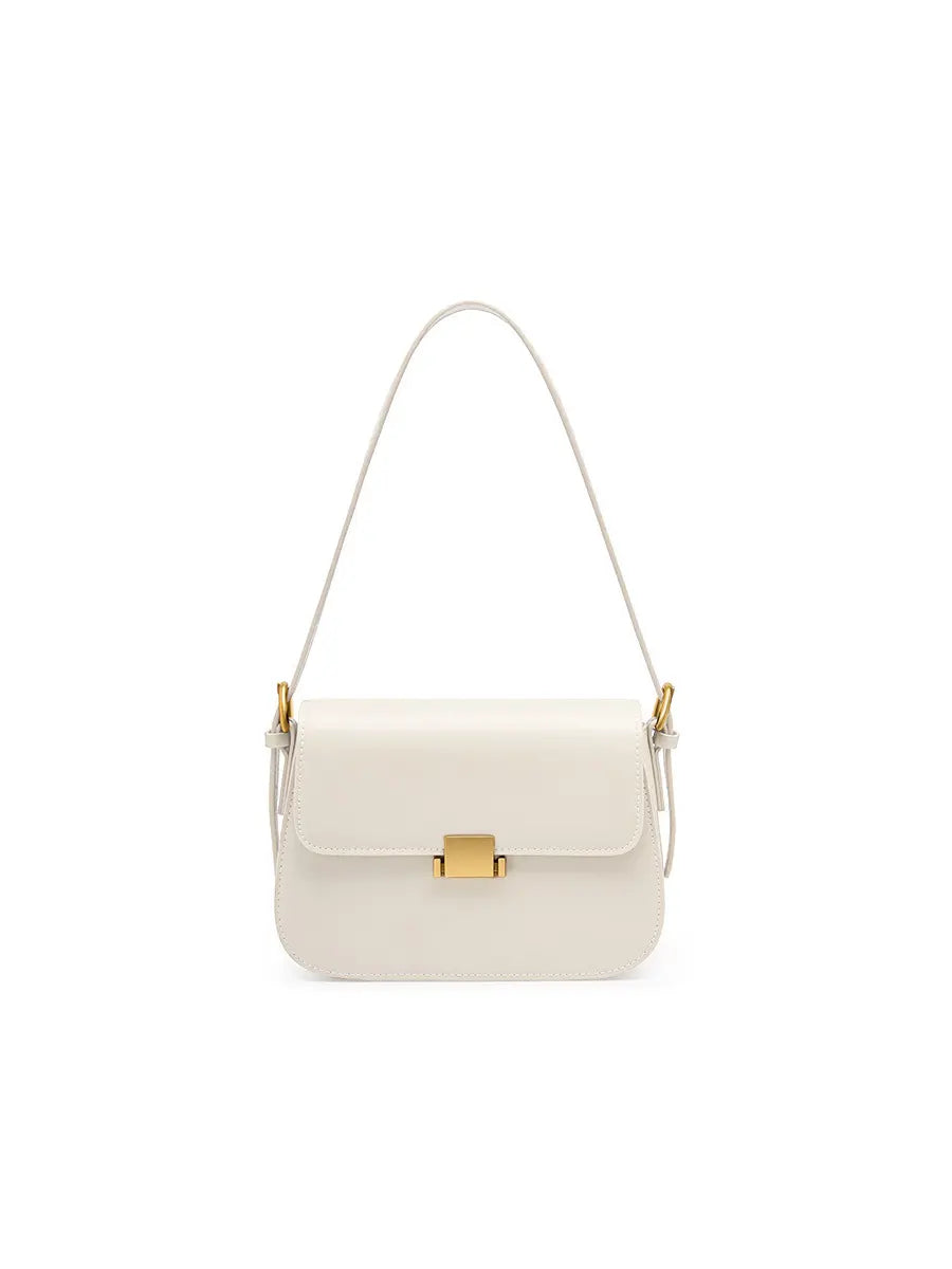 White handbag with gold clasp on a white background