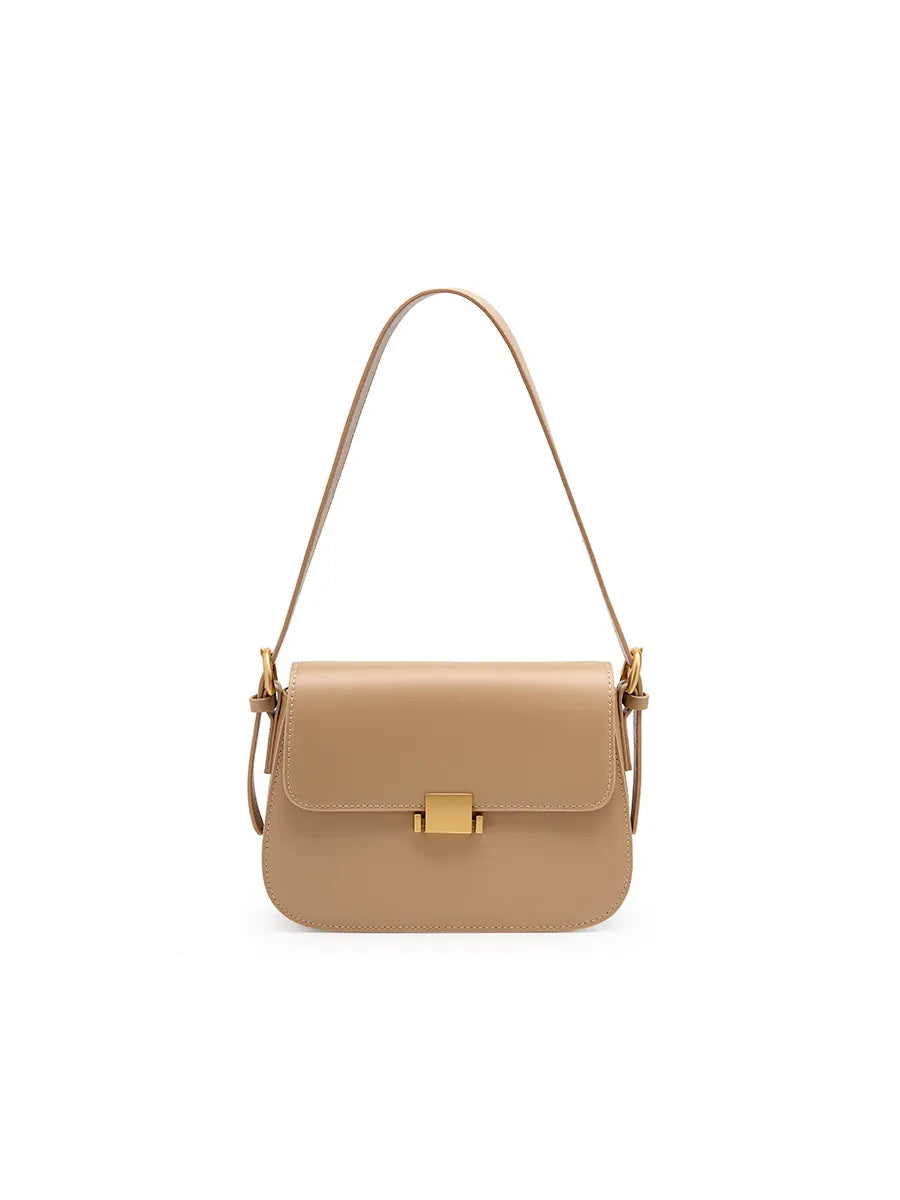 Beige handbag with a gold clasp on a white background