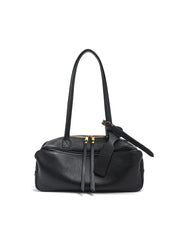 Black handbag with gold accents on a white background