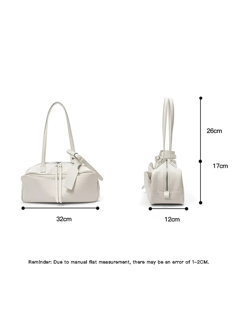 White handbag with dimensions labeled on a white background