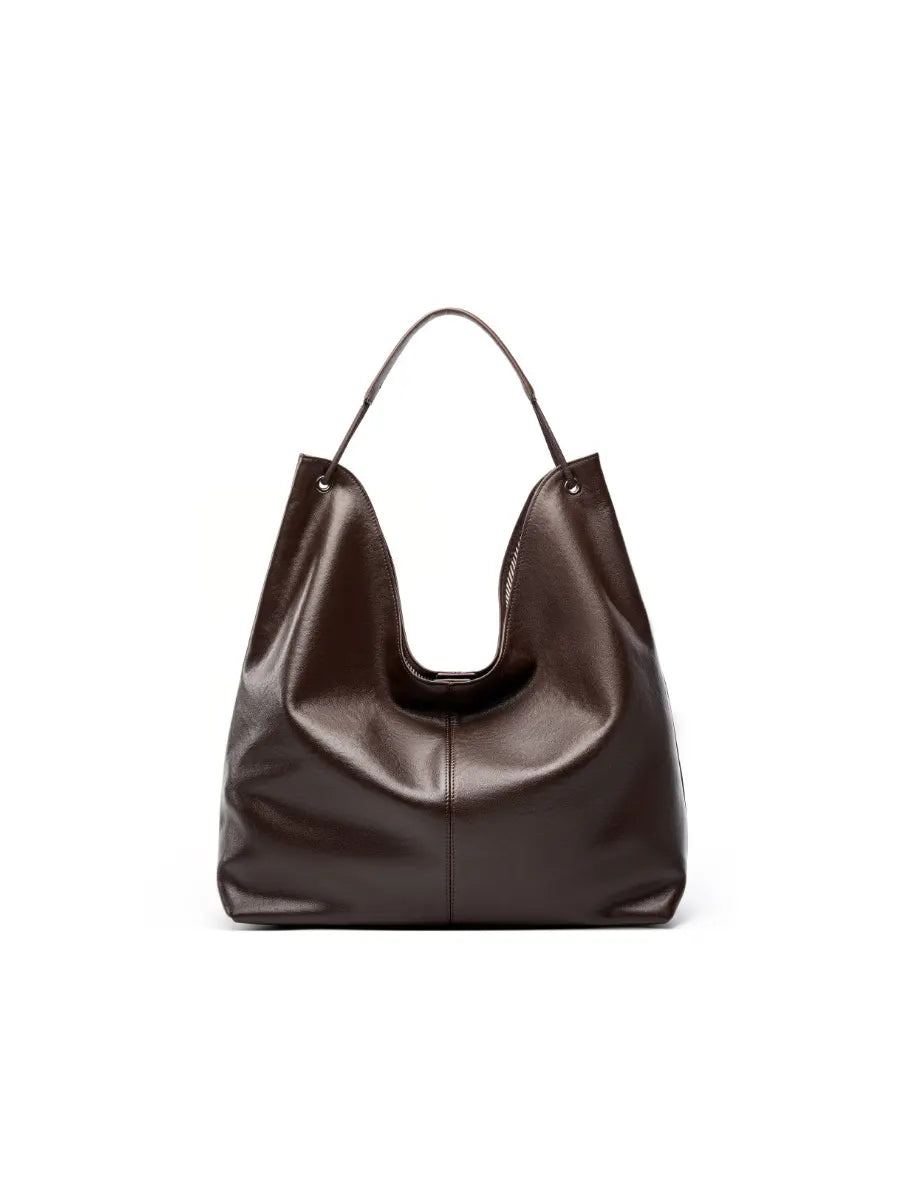 Brown leather handbag on a white background