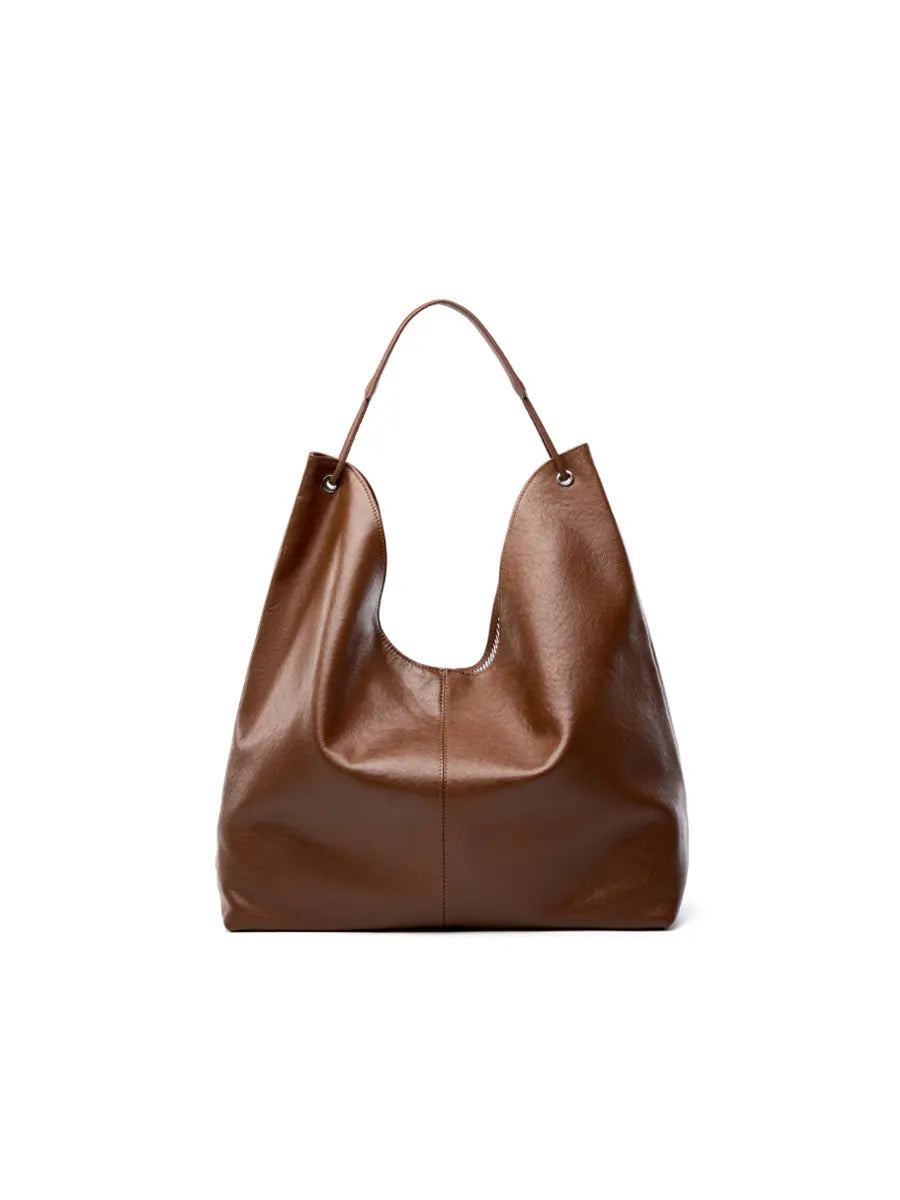 Brown leather handbag on a white background