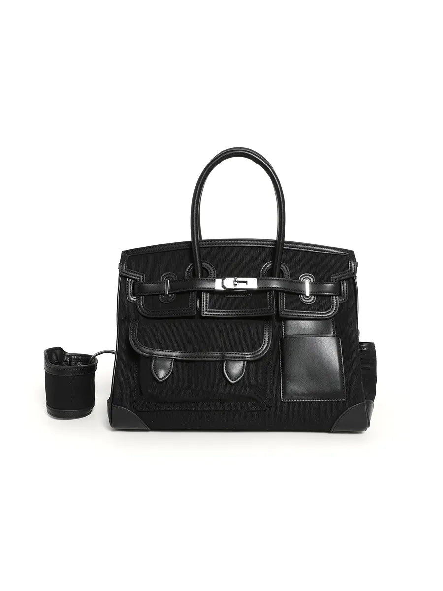 Black handbag with a matching cup holder on a white background