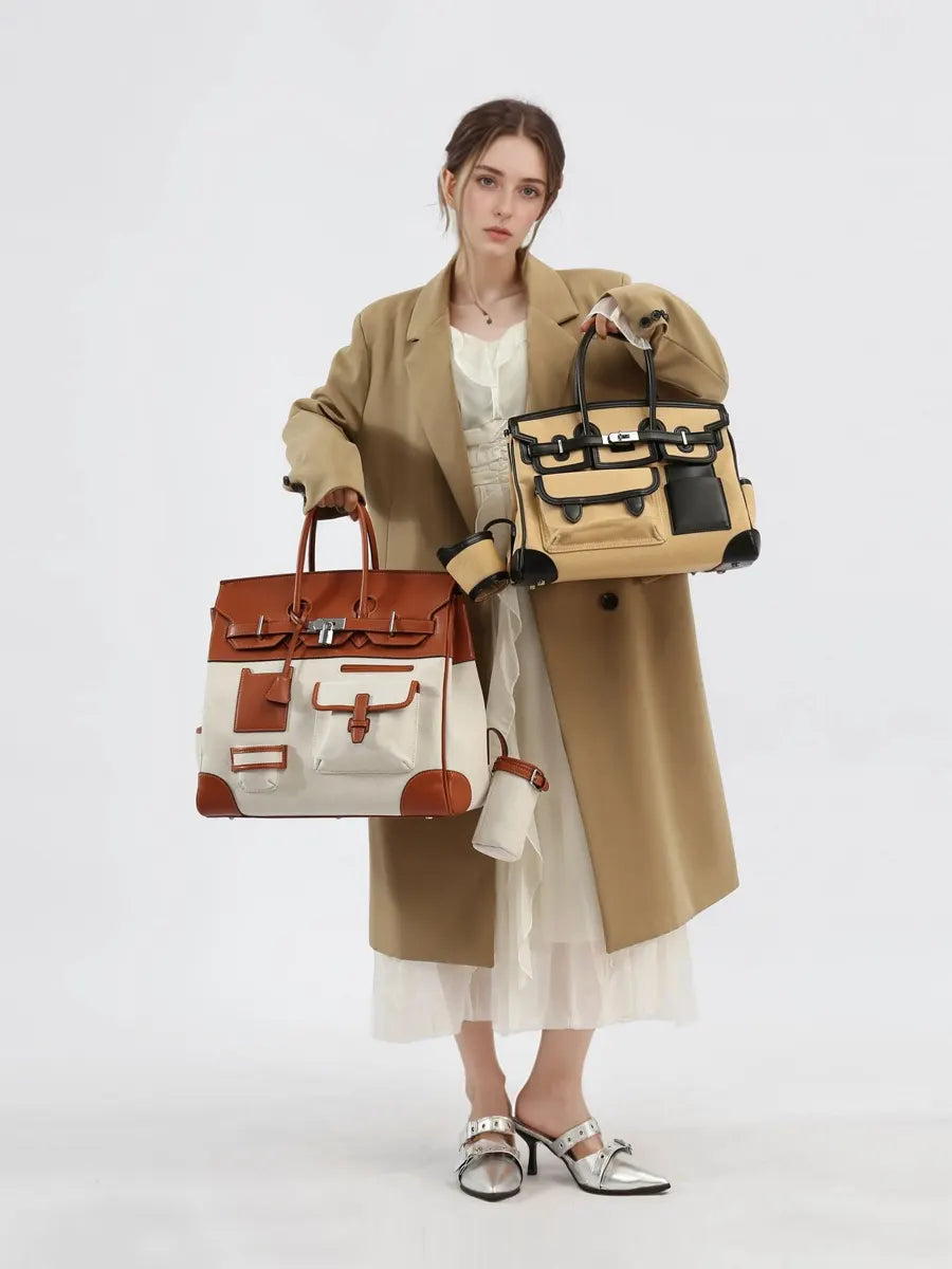 Woman holding two handbags against a white background