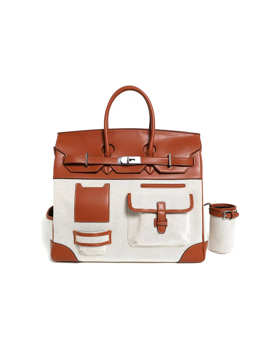 Brown and white handbag with matching pouch on a white background