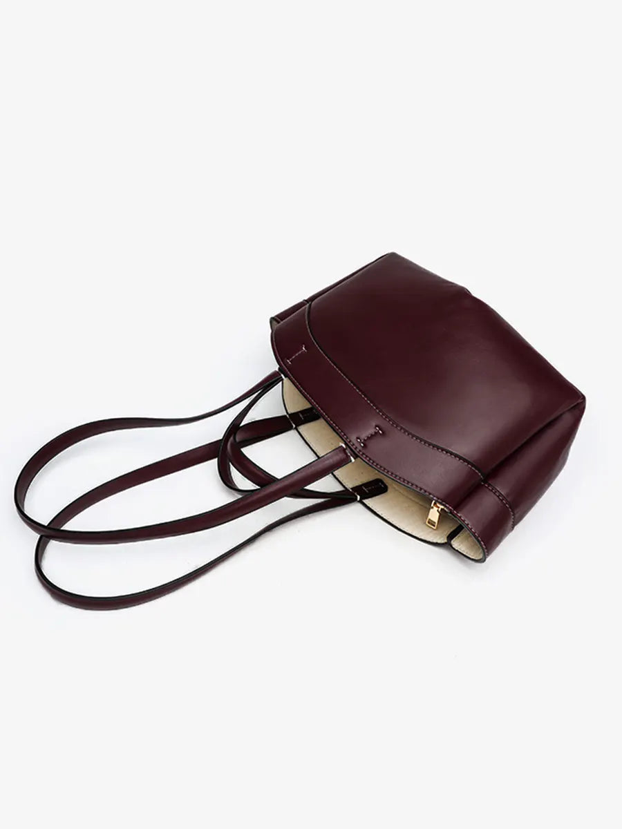 Brown leather backpack on a white background