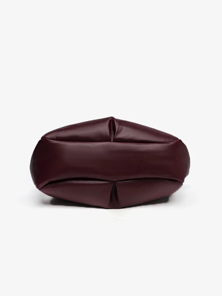 Brown leather bag on a white background