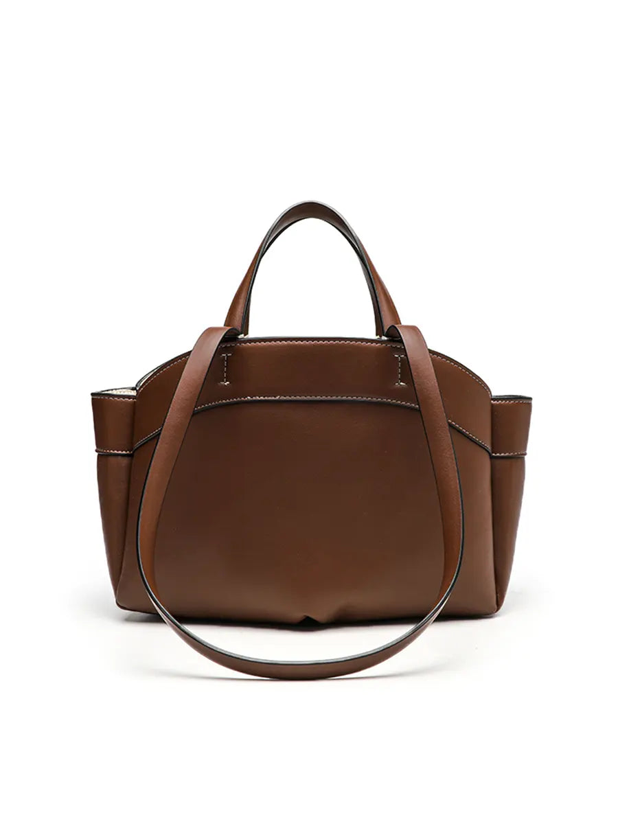 Brown leather handbag on a white background
