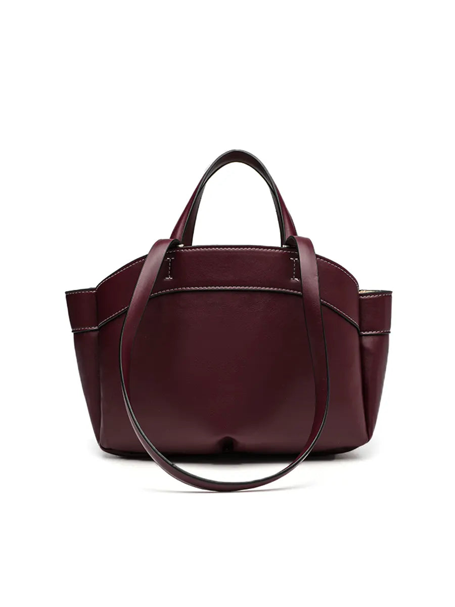 Burgundy handbag on a white background