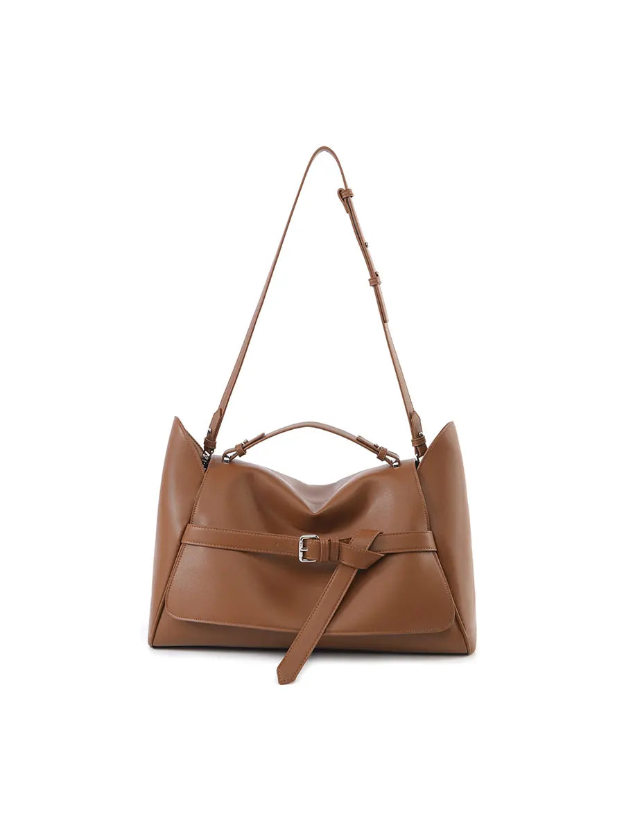 Brown leather handbag with a strap on a white background