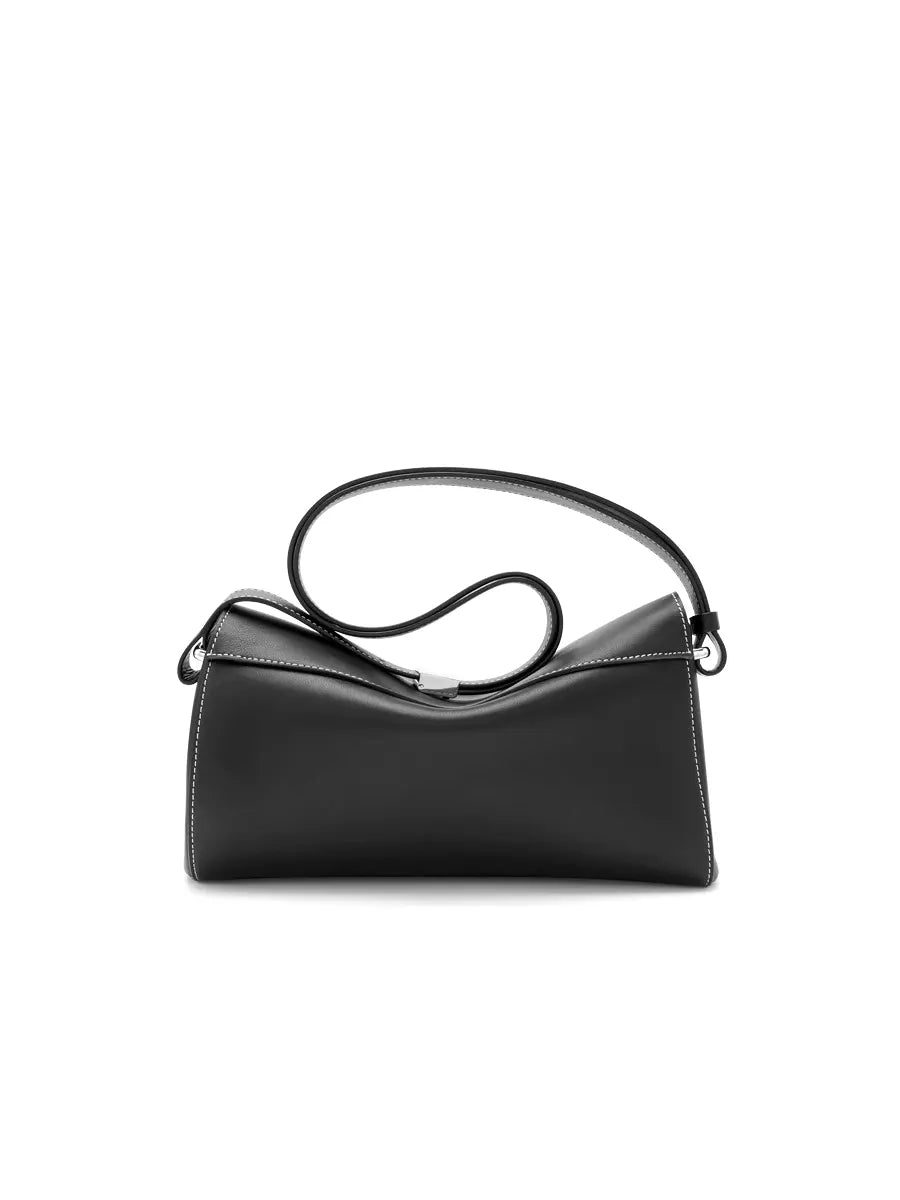 Black handbag with a strap on a white background