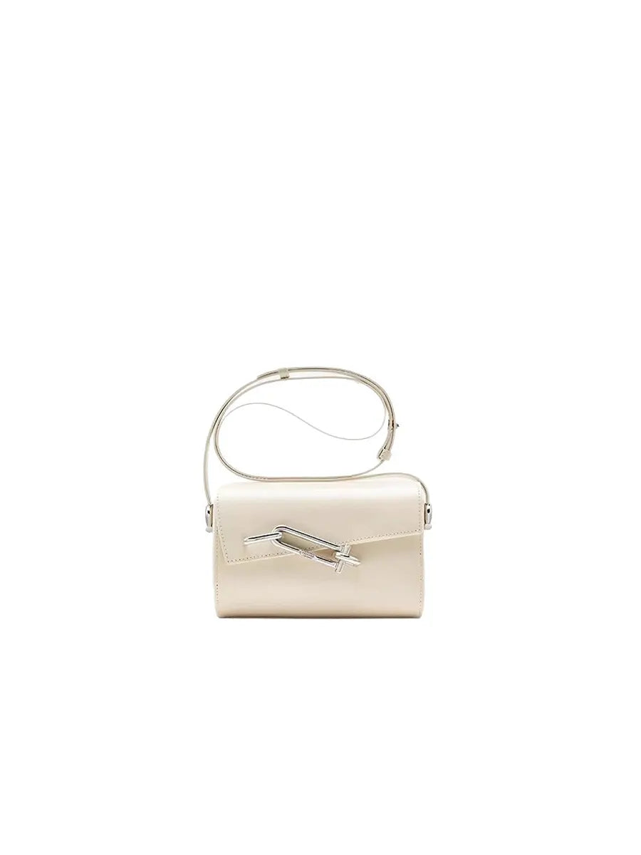 Beige handbag with a silver clasp on a white background