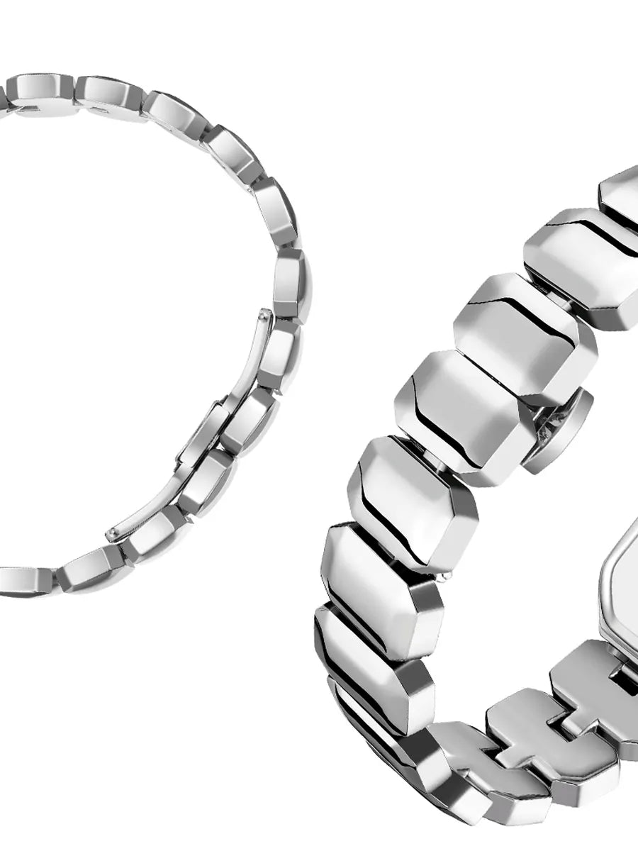 Close-up of a silver bracelet with a white background
