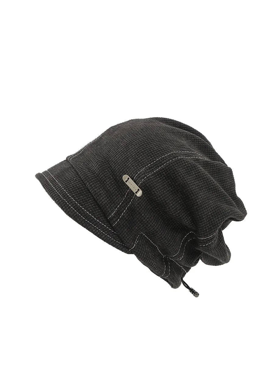 Black textured bucket hat on a white background