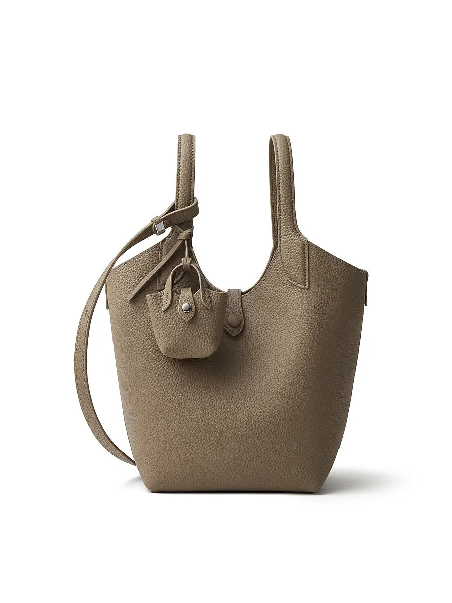 Beige handbag with a strap on a white background