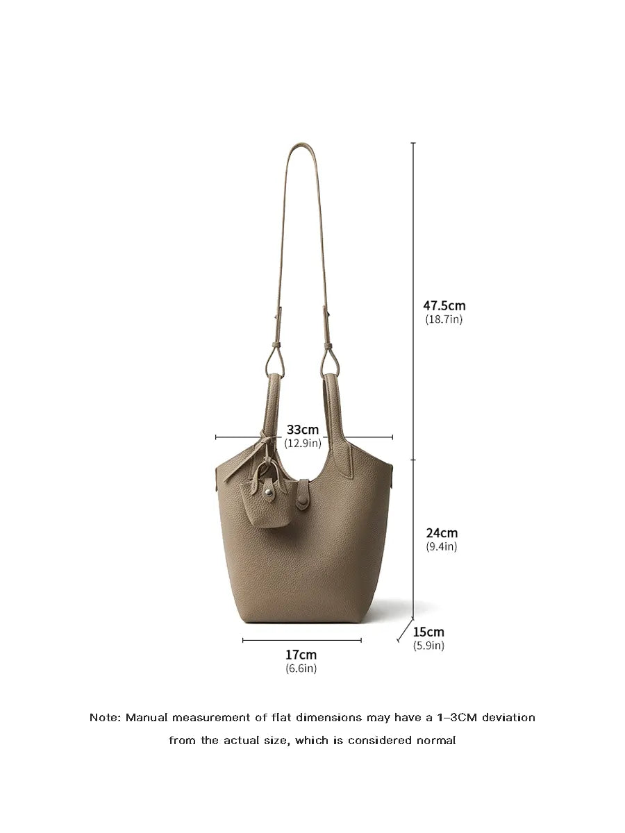 Beige handbag with dimensions labeled on a white background