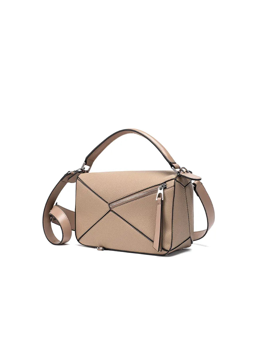 Beige handbag with a unique geometric design on a white background