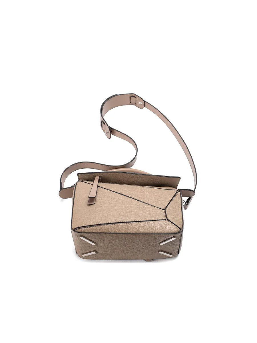 Beige handbag with a unique geometric design on a white background