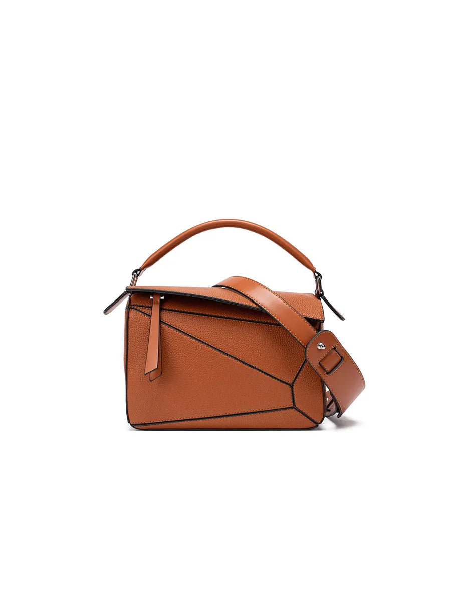 Brown leather handbag on a white background
