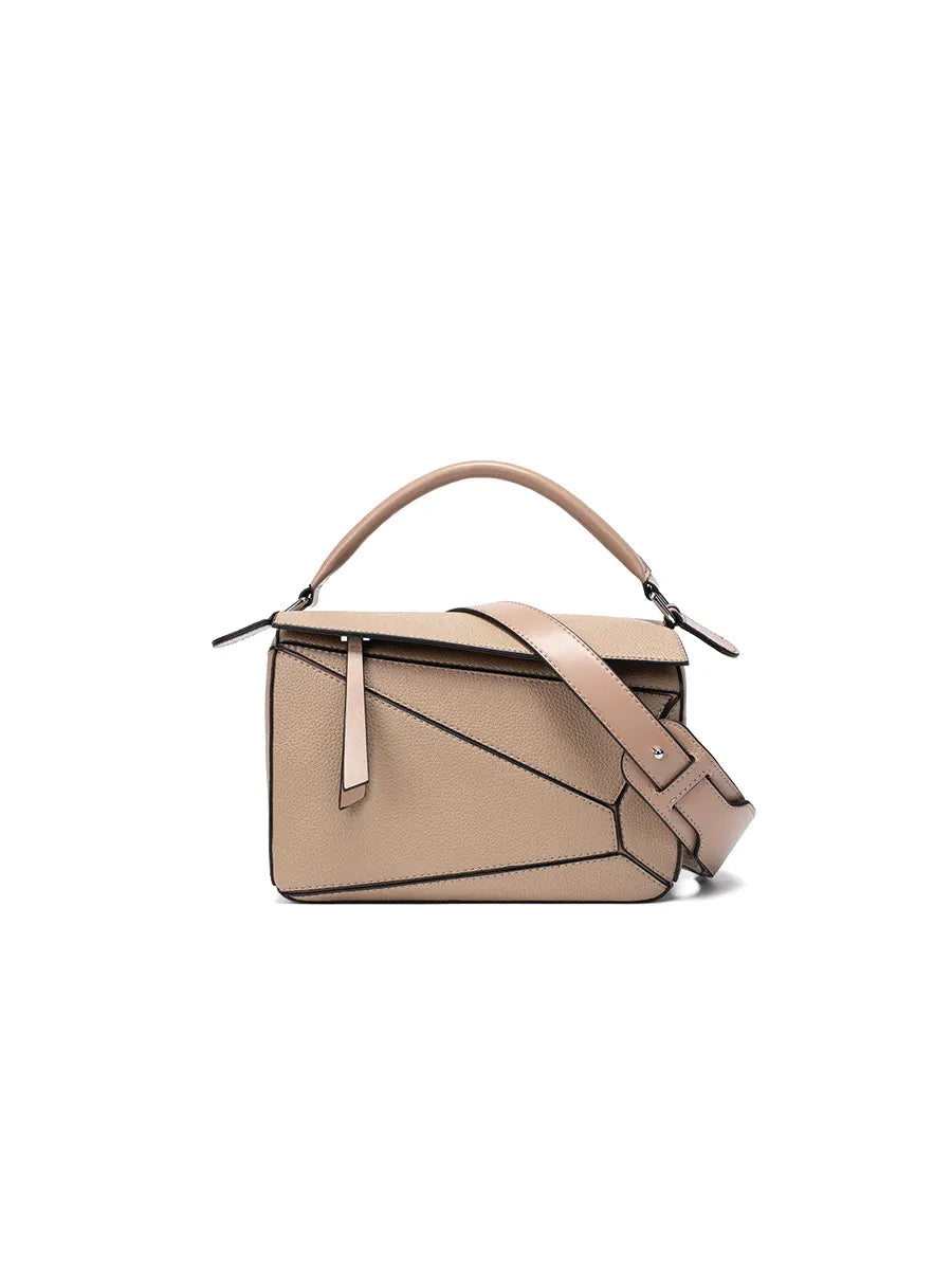 Beige handbag with a shoulder strap on a white background