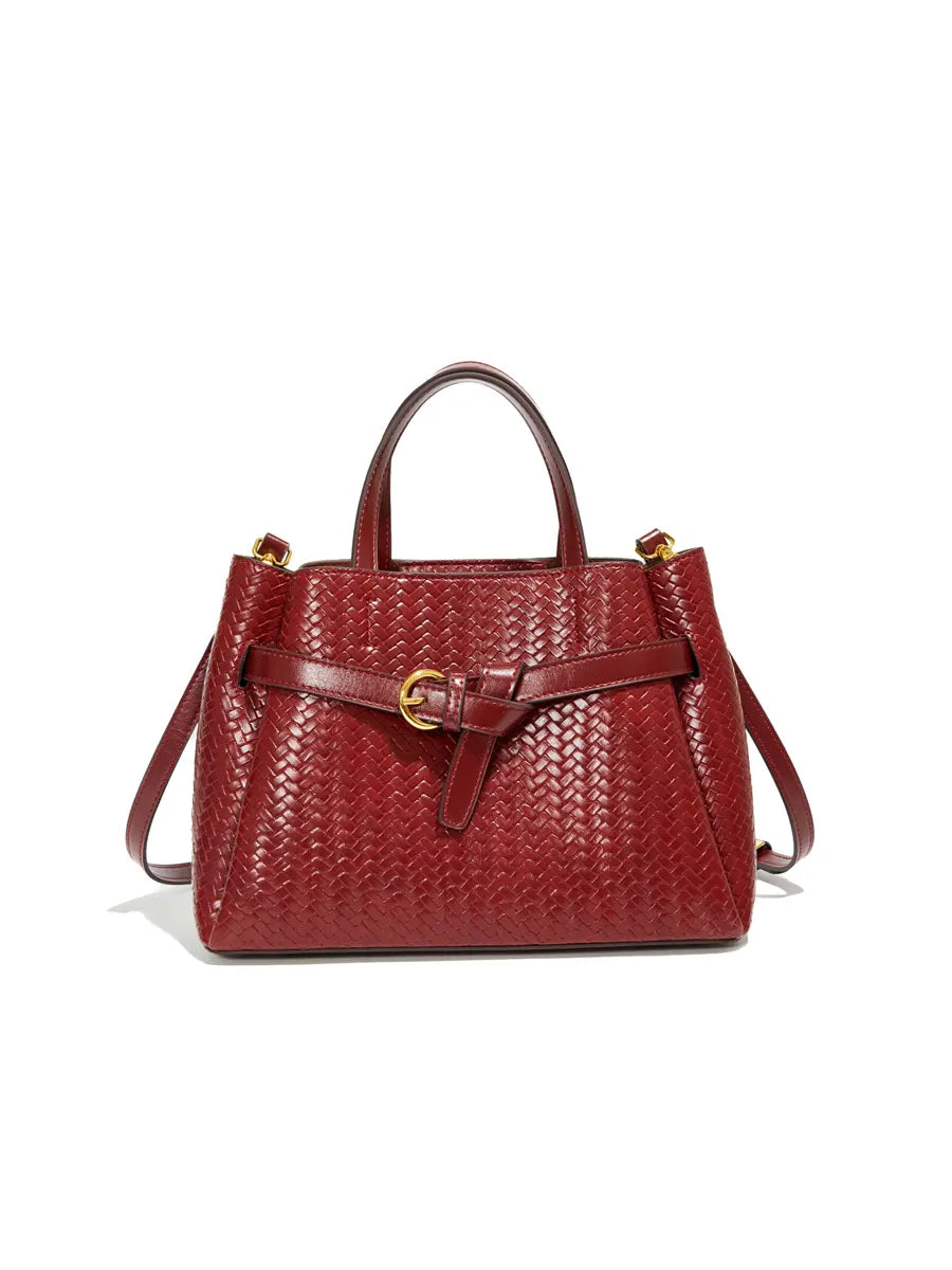 Red woven handbag with a strap on a white background