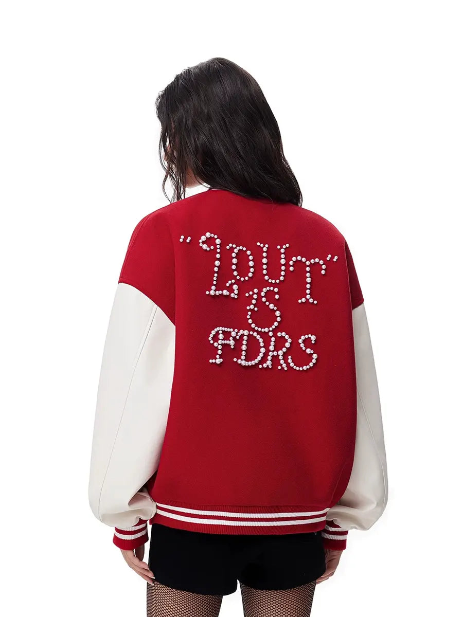 Red and white varsity jacket with text on the back, worn by a person.