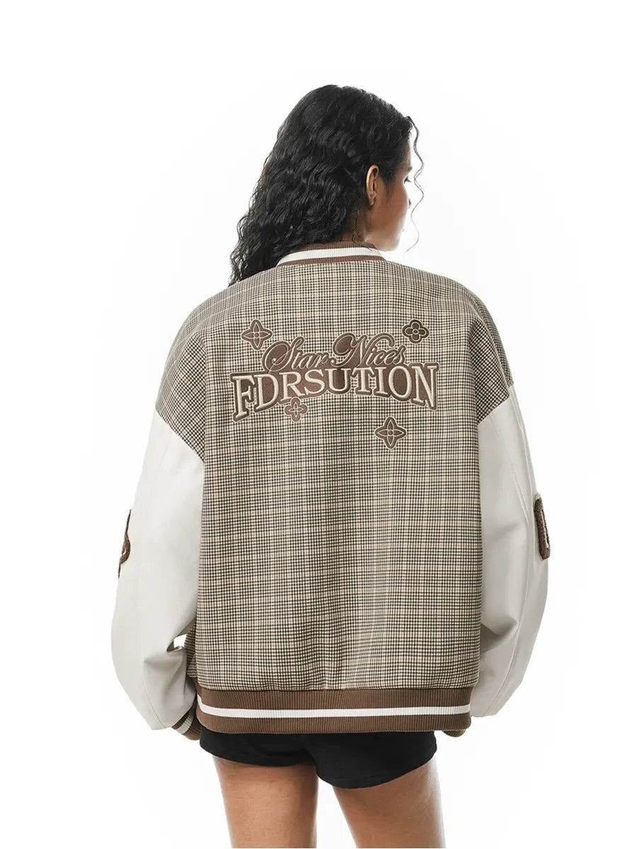 Person wearing a plaid varsity jacket with text on the back against a white background