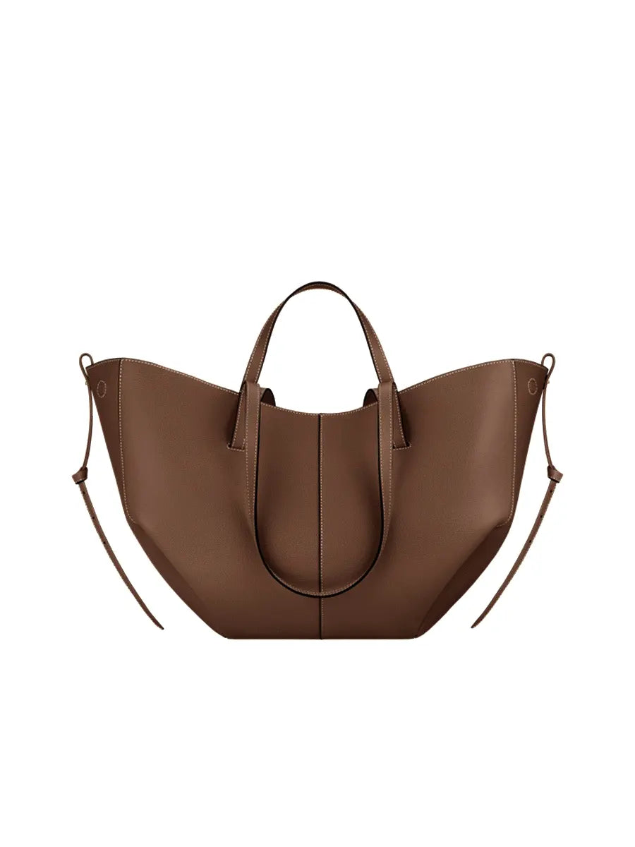 Brown leather handbag on a white background