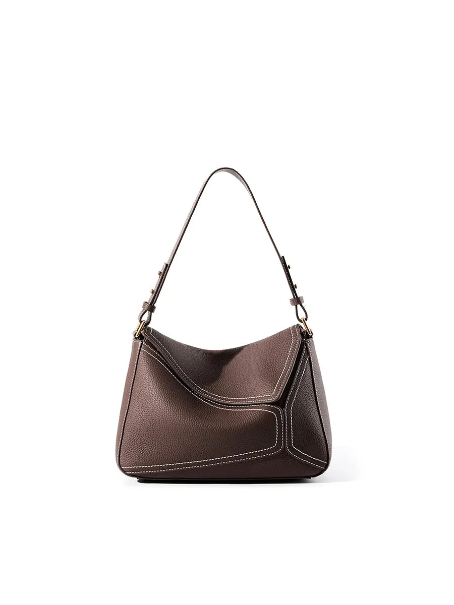 Brown handbag with a strap on a white background