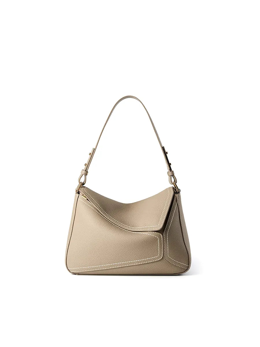 Beige handbag with a strap on a white background