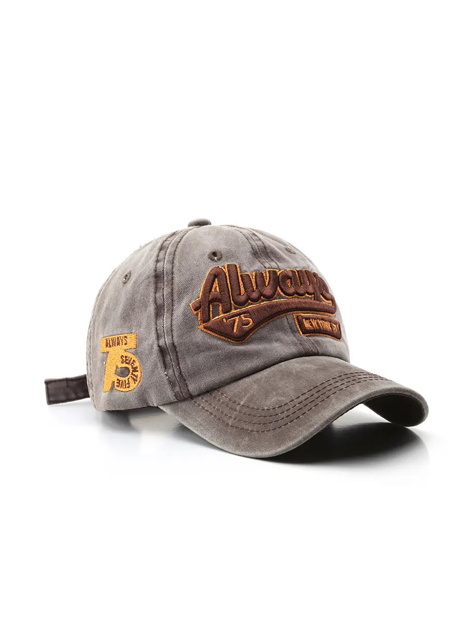 Gray cap with brown and yellow patches on a white background