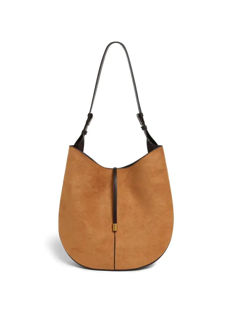 Brown leather handbag with black accents on a white background