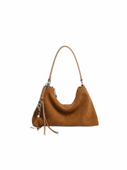 Brown handbag with a strap on a white background