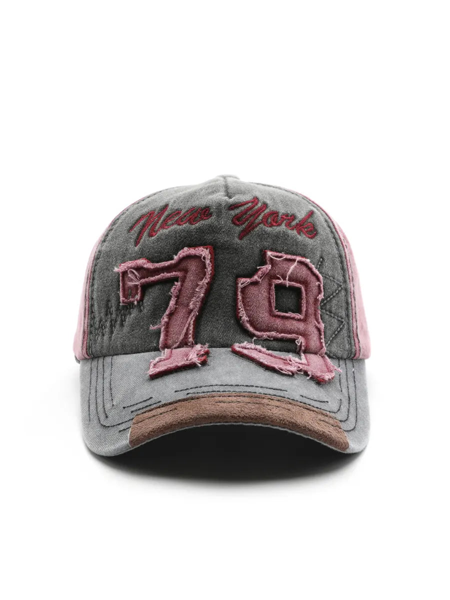Gray cap with pink 'New York' and '70' text on a white background