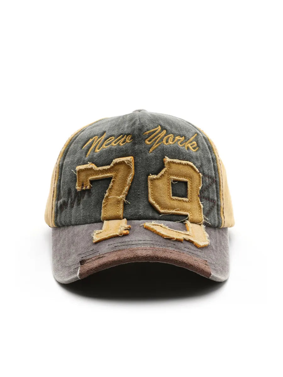 Vintage-style cap with 'New York 79' text on a white background