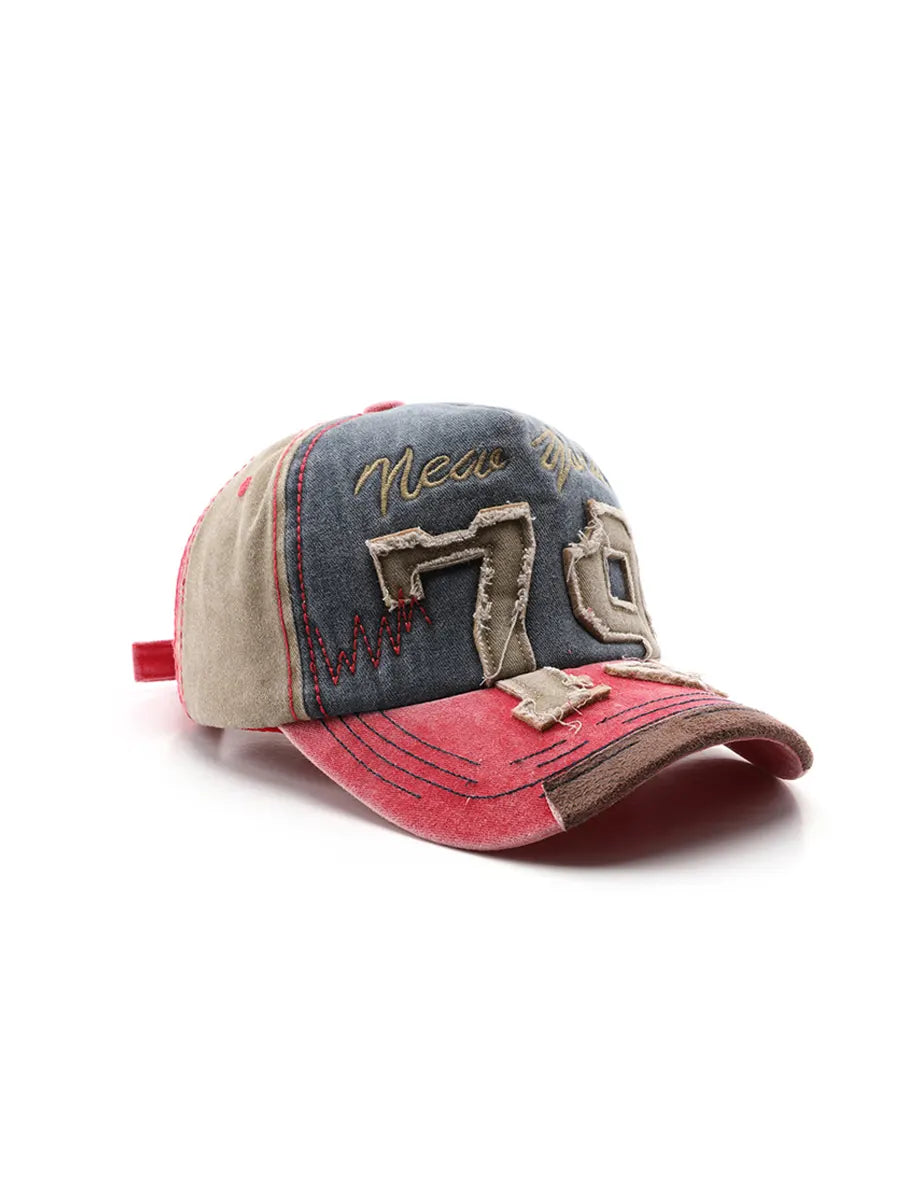 Vintage-style cap with denim and red design on a white background